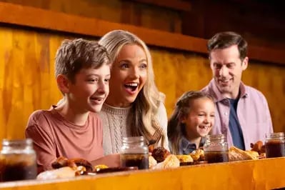 family watching the Stampede and eating