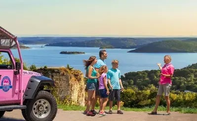 family taking a Pink Jeep Tour