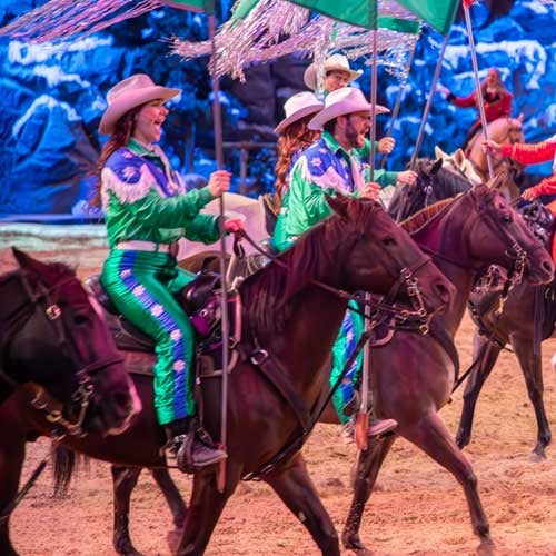 Horse riders in green