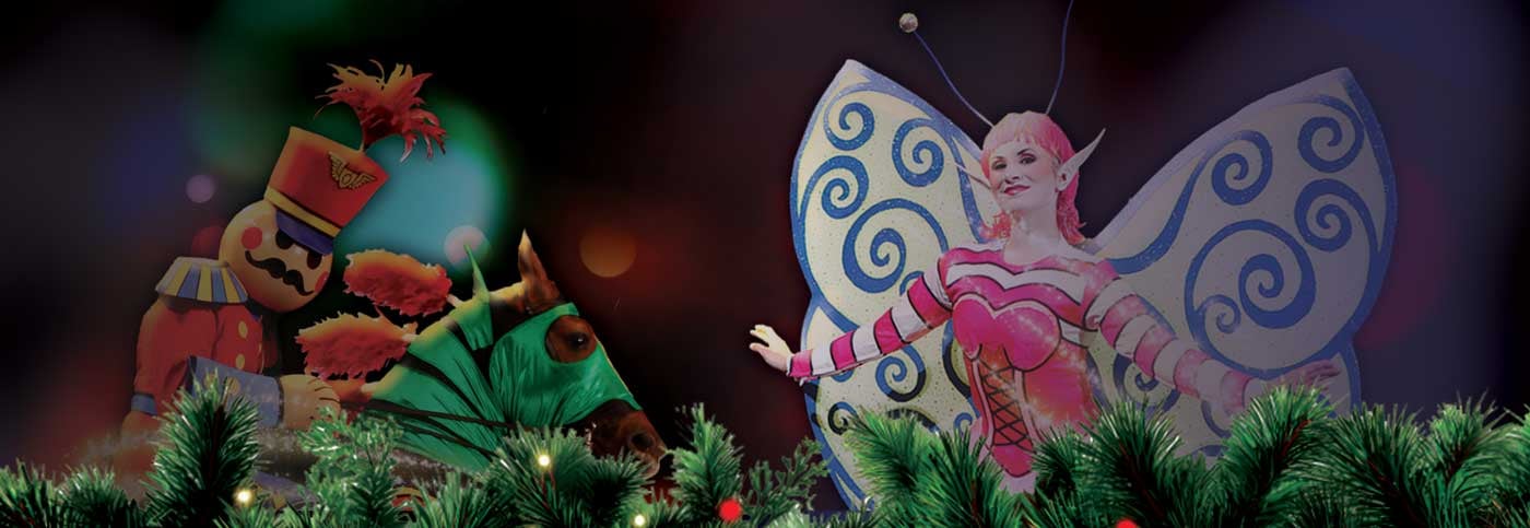 Christmas toys come to life, A toy solider on a real horse rears up as a sugar plum fairy flies next to him