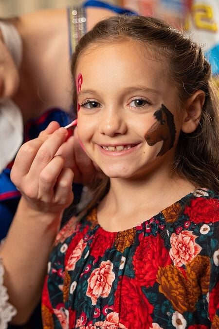 young Stampede guest having her face painted