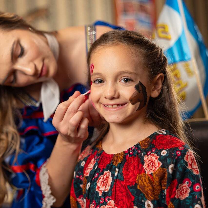 Young girl with face painted