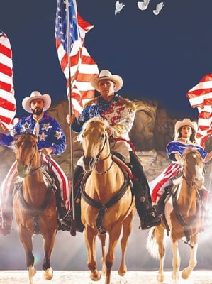 The host and riders at the Stampede. 