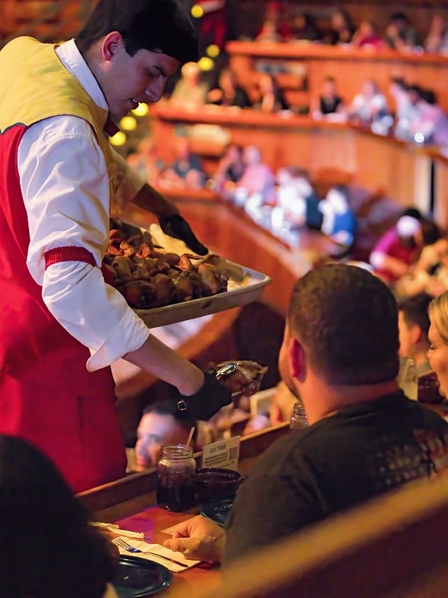 a server serving dinner during the show.