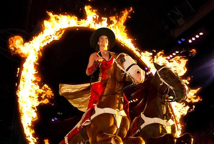 performer riding horse through ring of fire at Dolly Parton’s Stampede in Branson