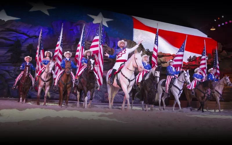 Dolly Parton’s Stampede cast during grand patriotic finale