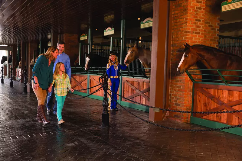 family enjoying Horse Walk at Dolly Parton’s Stampede