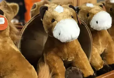 Plush horses in gift shop at Dolly Parton's Stampede