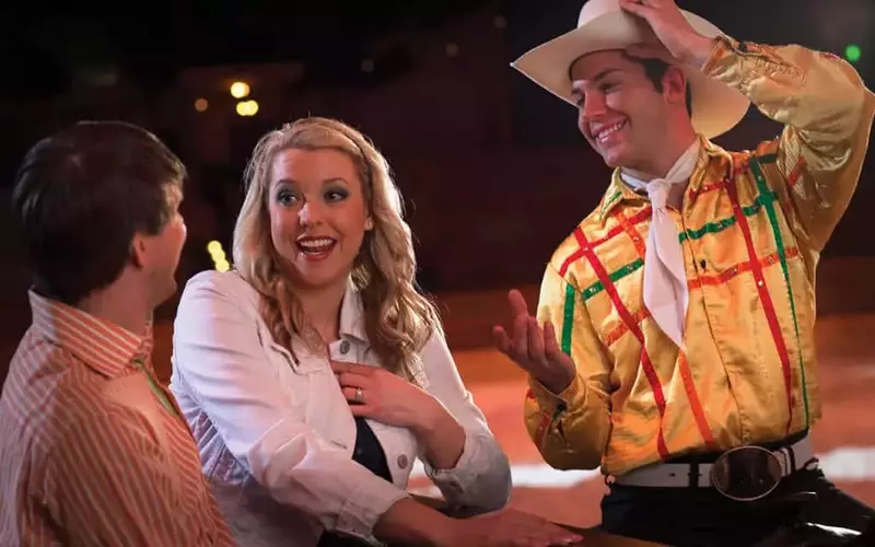 Couple talking to server at Dolly Parton’s Stampede in Branson