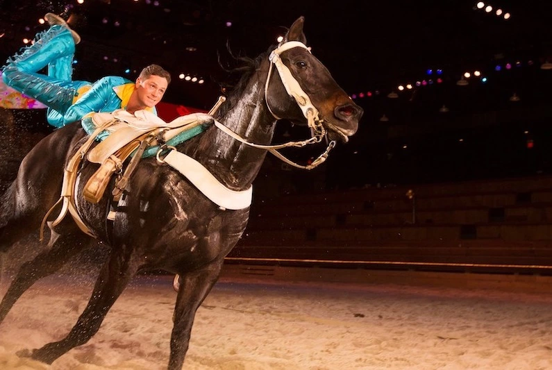 trick rider on horse at Dolly Parton's Stampede