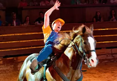 Skeeter falling off horse at Dolly Parton's Stampede