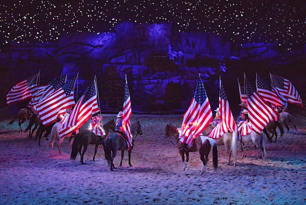 riders with flags during grand finale