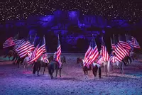 riders with flags during grand finale