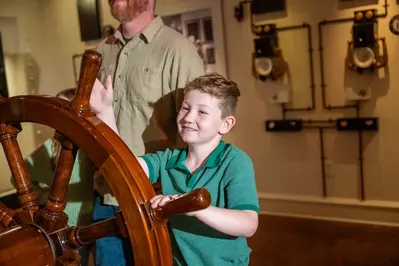kid steering wheel at Titanic Museum